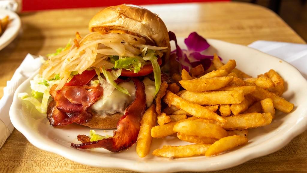 Chipotle Burger · Seven ounce fresh angus ground beef, bacon, lettuce, tomatoes,caramelized onions, chipotle mayo and American cheese on a fresh brioche bun.