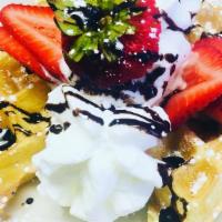 Fruity Waffle · Belgian waffle topped with mixed fruit and whipped cream.