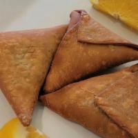 Sambusa (Samosa) · A triangular, deep-fried pastry stuffed with beef, chicken, or vegetable, and lentils