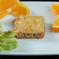 Baklava · A rich sweet dessert pastry made of layers of folo filled with chopped nuts and sweetened an...