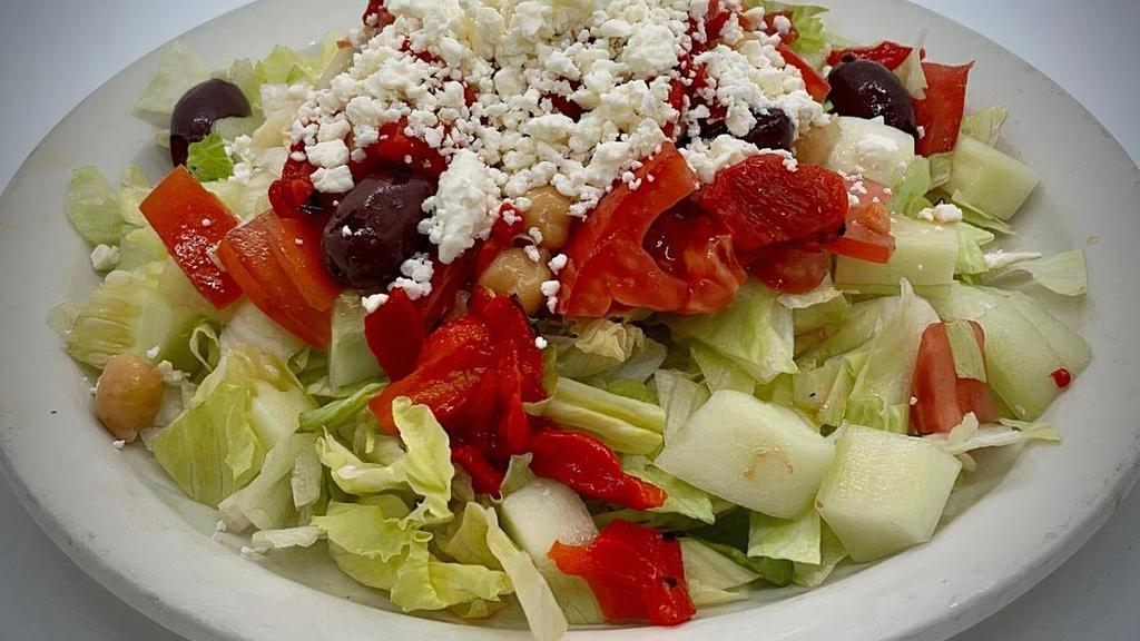 Individual Cassie'S Chopped Salad · Romaine Lettuce, Peas, Roasted Red Peppers, Olives, Cucumber, Chopped Tomatoes, Feta Cheese, Italian Dressing