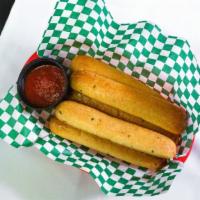 Garlic Parmesan Breadsticks · Six-piece Parmesan garlic breadsticks baked to a golden perfection served with our house mar...