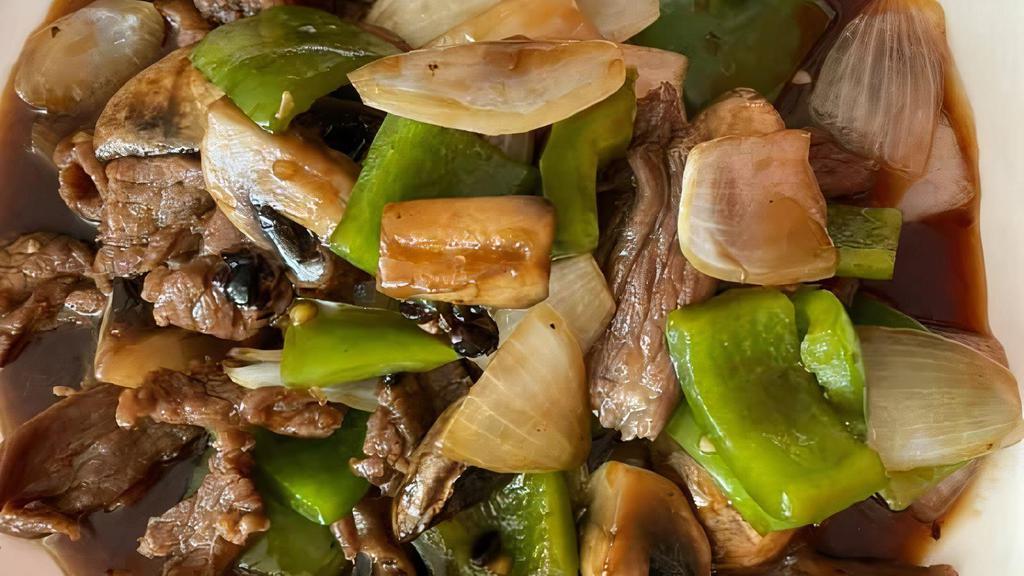 Pepper Beef · Marinated beef stir-fried with bell peppers, onions and mushrooms in black bean sauce.
