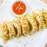 Potstickers · Steamed dumpling stuffed with a delicate blend of chicken and vegetable then pan fried with ...