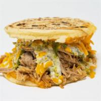 Rumbera · Gluten free. Loaded with pulled pork and Cheddar cheese, dressing with avocado sauce and gar...