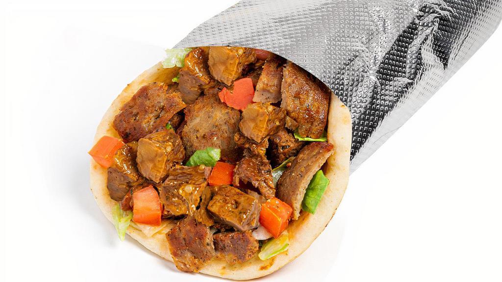 Savory Herb Beef & Gyro Sandwich · Tender, seared sirloin marinated in a Savory spice blend with savory beef gyro served in a warm pita with your choice of additional toppings