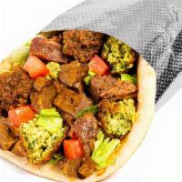 Savory Herb Beef & Falafel Sandwich · Tender, seared sirloin marinated in a Savory spice blend with crispy falafel served in a war...