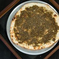 Zaatar Flatbread · Thyme, sumac, sesame seeds, olive oil, seasoning.
