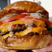 Double Cheeseburger · two angus brisket blend patties, american cheese, lettuce, tomato, garlic dill pickles, butt...