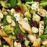 Kennedy Salad · Romaine spinach, avocado, cranberries, almonds, corn, raisins, grapes, mango, with Munster a...
