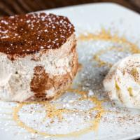 Tiramisu Cake · Espresso infused vanilla cake with mascarpone cream.