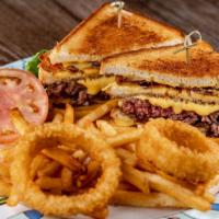 Big Daddy Burger · Twin grilled cheese sandwiches stacked above & below our 8 oz. bacon burger, topped with oni...