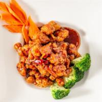 Orange Chicken · Spicy. Chunks of crispy chicken with green onions, dry orange peels and chili peppers sautée...