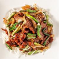 Mongolian Beef · Sliced beef tenderloin sauteed with green onions, onions, and bamboo shoots.