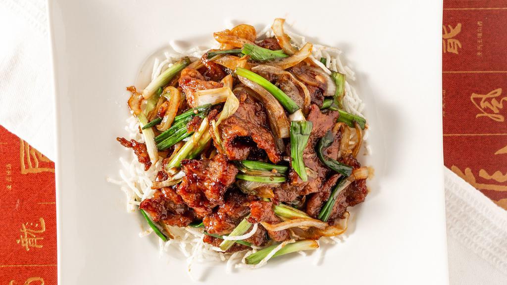 Mongolian Beef · Sliced beef tenderloin sauteed with green onions, onions, and bamboo shoots.
