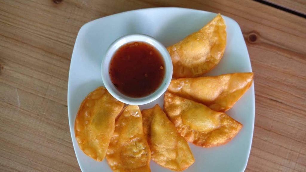 Fried Wonton 7Pcs · Ground chicken wrapped in wonton skin, served with sweet chili sauce.