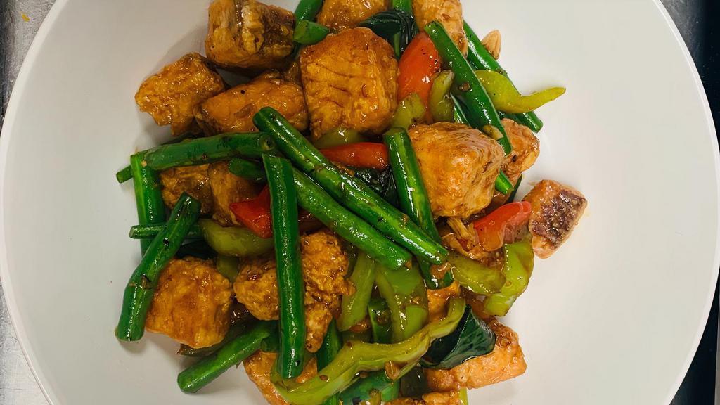 Salmon Kra Pao · Medium Spicy. Sautéed crispy salmon with string bean, green pepper, red bell pepper, and basil sauce.