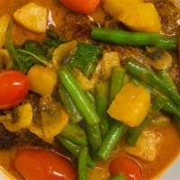 Duck Pineapple Curry · Mild Spicy. Basil, tomato, mushroom, pineapple, and string bean.