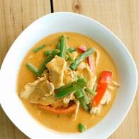 Panang Curry · Mild Spicy. Kaffir lime leaves, string beans, and red bell pepper.