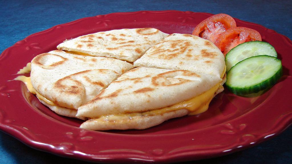 Grilled Cheese Sandwich · Pita bread and American cheese.