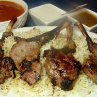 Grilled Lamb-Chops · Half rack (8 oz.: 3-4 chops depending on size) with lime and raita, rice with tikka sauce.
