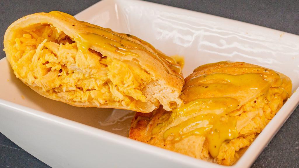 Peruvian Empanadas · Homemade pastry-style dough stuffed with our house fillings and baked daily.