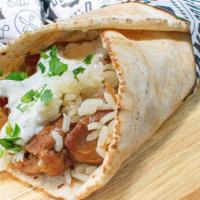 Chicken Wrap · Grilled Chicken wrapped in a pita bread with rice and tzatziki
