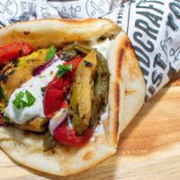 Vegetable Gyro · Grilled vegetable mix wrapped in Greek pita with tzatziki, tomato and onion (For Vegan ask u...