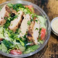 Grilled Chicken Salad · Garden salad topped with Mediterranean grilled chicken and side of our home-made healthy app...