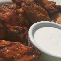 Chicken Wings · Regular or Boneless. Tossed in a sauce of your choice with ranch or blue cheese.