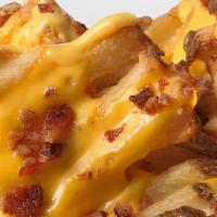 Cheesy Waffle Fries · Topped With Melted Shredded Cheese and your choice of Bacon or Garlic Parmesan.