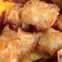 Cheesy Tots · Topped With Melted Shredded Cheese and your choice of Bacon or Garlic Parmesan.