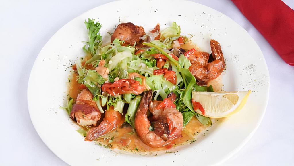Shrimp Casino · Jumbo shrimp wrapped in bacon, served with olive oil, white wine, garlic, and pimento sauce.