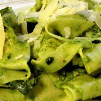Homemade Pappardelle Al Pesto · Pesto made with basil, olive oil, pine nuts, and parmigiano reggiano.