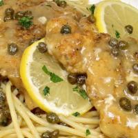Veal Picatta · Veal scaloppini sautéed in lemon-butter sauce with capers.