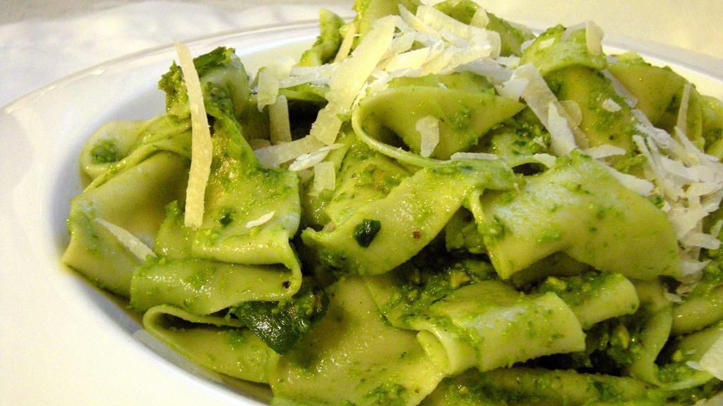Homemade Pappardelle Al Pesto · Pesto made with basil olive oil pine nuts and parmigiano reggiano.
