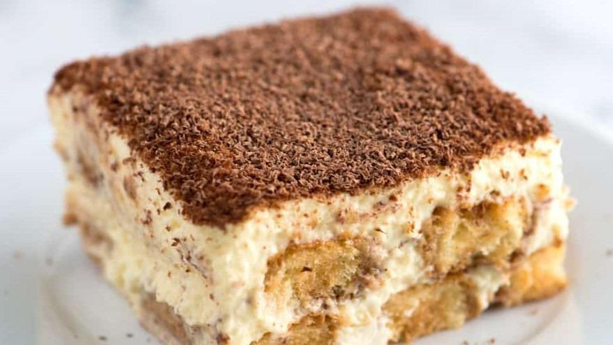 Homemade Tiramisu · Coffee flavored Italian dessert, ladyfingers dipped in coffee, layered with a mixture of eggs, sugar, mascarpone cheese, topped with cocoa.