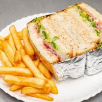 Chicago Club Sandwich With Chips & Can Of Soda · 