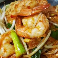 Pad Thai · Stir-fried thin rice noodles with choice of meat, egg, ground peanuts, bean sprouts and gree...