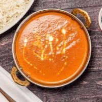 Butter Chicken Curry · Tandoori oven baked chicken cooked with onion, tomato and creamy sauce into authentic style.