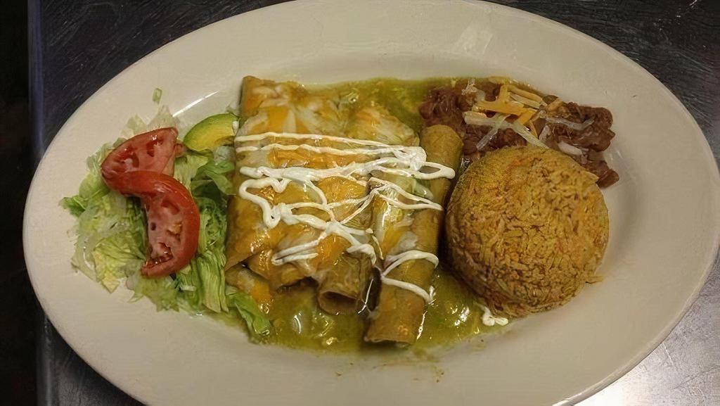 Flautas Combo · Four crispy chicken taquitos, topped with lettuce, sour cream, pico de gallo sprinkled with parmesan cheese, served with refried beans and rice.