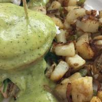 Spring Benedict · Sliced ham, spinach, two poached eggs and pesto-hollandaise sauce on English muffin & side o...