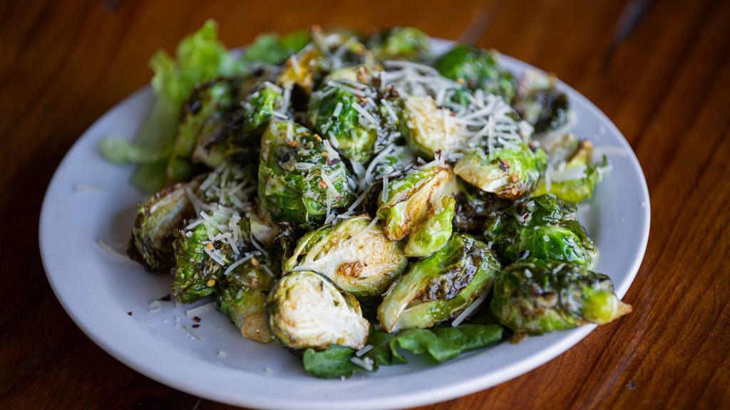Grilled Brussels Sprouts · Tossed with olive oil, balsamic vinaigrette, honey mustard, & crushed red peppers. Topped with Parmesan cheese.