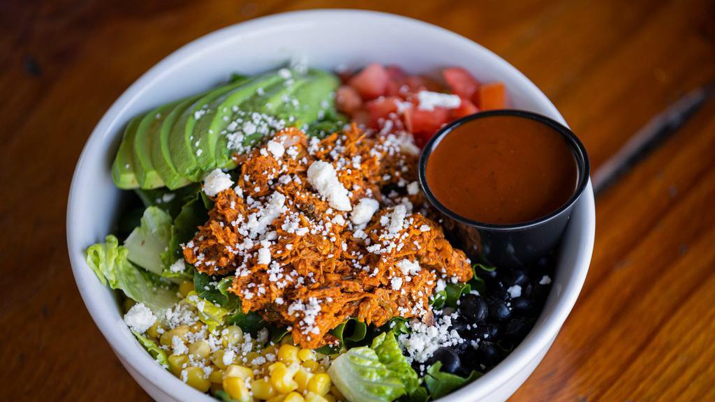 Mexican Salad Bowl · Choice of seasoned ground beef, chicken or pulled pork. With black  beans, corn, tomatoes, queso fresco, avocado on crispy  romaine lettuce with side of ancho dressing.
