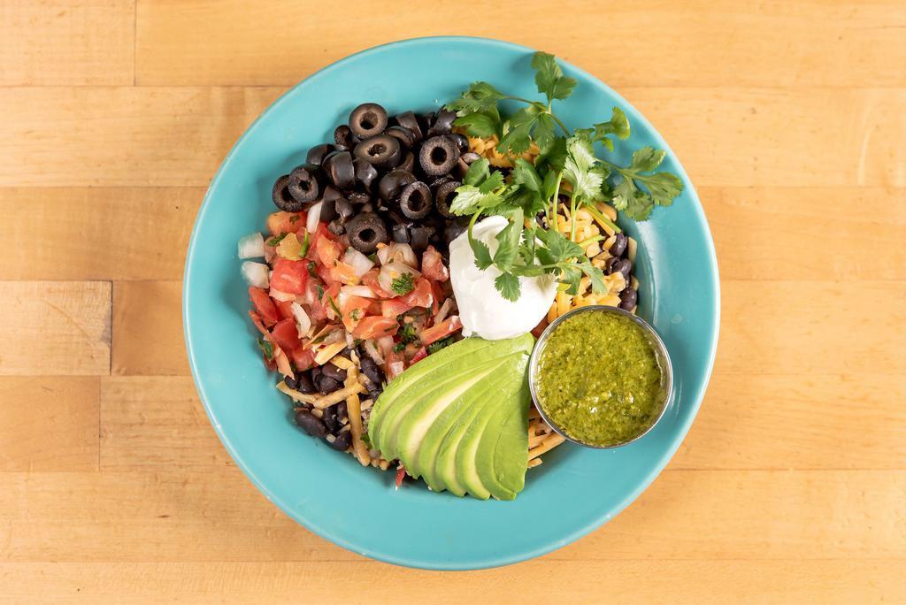 Comfort Bowl · Brown rice, black beans, cheddar cheese, black olives, sliced avocado, pico de gallo, sour cream, cilantro, Nutritional Yeast sauce served on the side.