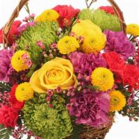 Colorfulness · Color is the name of the game in this blooming basket. From sunshine yellow roses and daisy ...