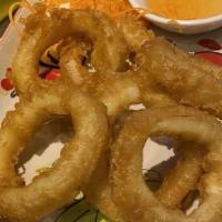 Fried Calamari · Fried ring squid, lightly battered and deep-fried served with sweet and sour sauce.
