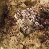 Baba Ghanouj Dip · A dip made of roasted eggplant mixed with tahini (sesame seeds paste), garlic, olive oil, an...