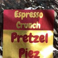 Espresso Crunch Pretzel Piez · Mound of pretzel nubs and twists, covered in milk chocolate, topped with white chocolate, es...