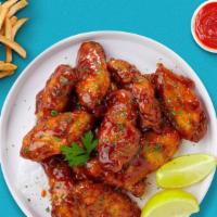 Aww Honey Bbq Wings · Fresh chicken wings breaded, fried until golden brown, and tossed in honey and barbecue sauc...